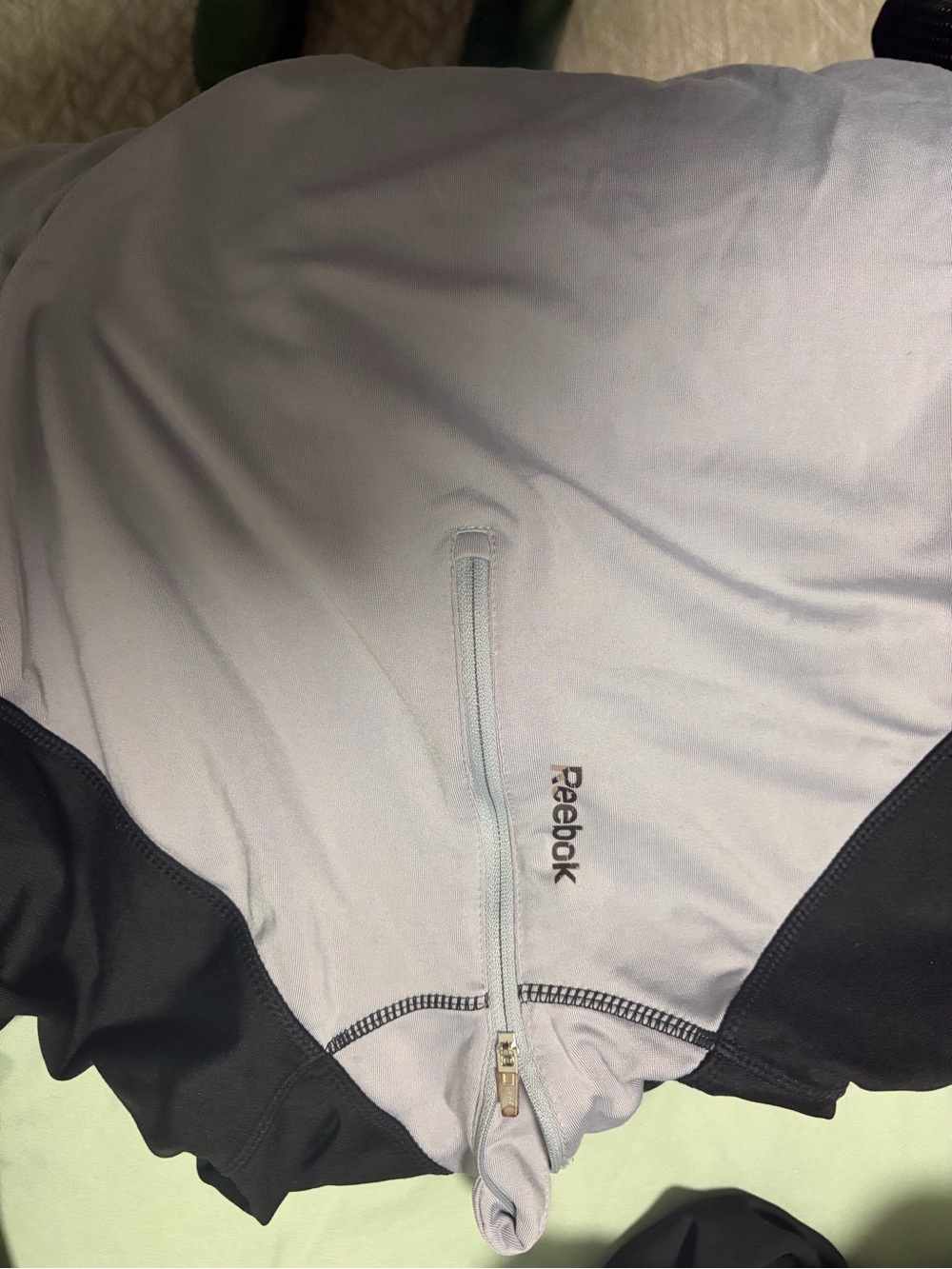 Reebok Men’s Light Gray and Black Performance Jacket with Zip Pocket